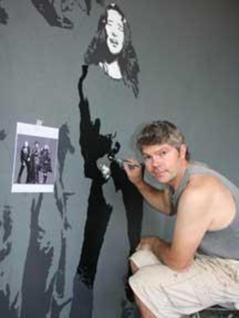 Mol painting a mural at a restaurant in Byron Bay in 2009. Picture: News Corp Australia