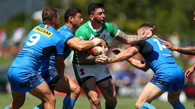 Oliver Roberts charges at the Italian defence.