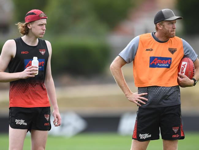 MELBOURNE, AUSTRALIA - FEBRUARY 19: Mason Fletcher and Dustin Fletcher watch on during an Essendon Bombers AFL training session at The Hangar on February 19, 2019 in Melbourne, Australia. (Photo by Quinn Rooney/Getty Images)