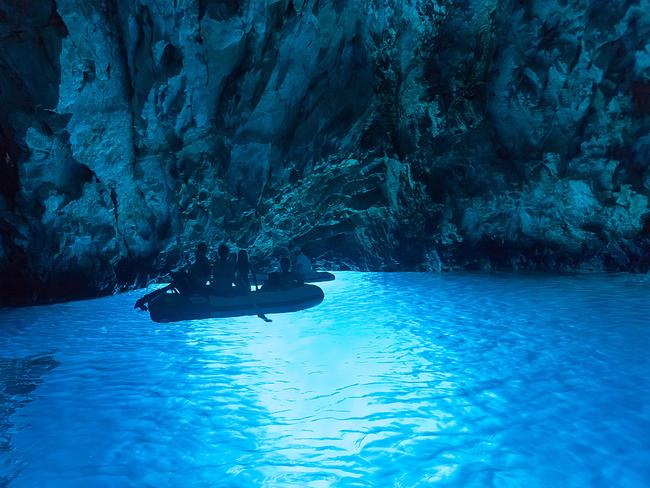 Tourists in inflatable boats inside the Blue Cave. Picture: iStock