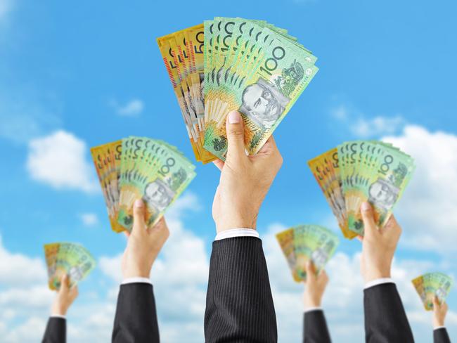 Hands holding money - Australian dollar (AUD) bills - money raising, funding & consumerism concept. equity crowdfunding - australian money for business ideas