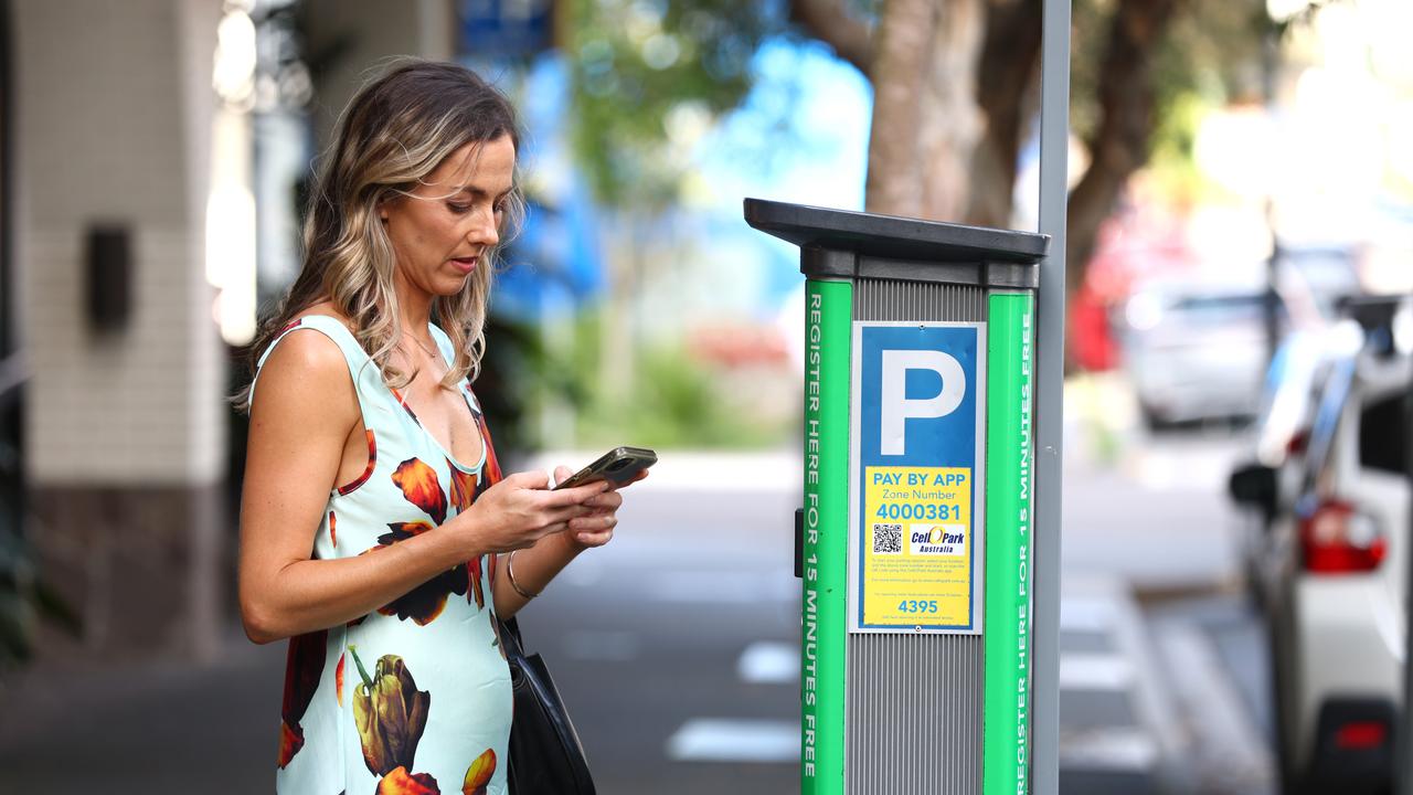 Hayley Miller pictured on Doggett Street, Fortitude Valley using her CellOpark App to pay for parking. Picture David Clark