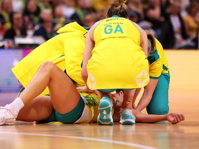 SYDNEY, AUSTRALIA - OCTOBER 30: Maddy Proud of Australia is receives attention from the trainers during game two of the International Test series between the Australia Diamonds and the England Roses at Qudos Bank Arena on October 30, 2022 in Sydney, Australia. (Photo by Mark Kolbe/Getty Images for Netball Australia)