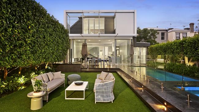 A modern extension and backyard behind the historic facade.