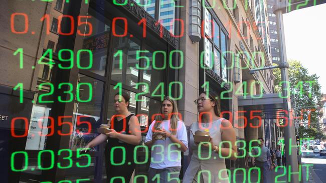 ????SYDNEY, AUSTRALIA : NewsWire Photos - FEBRUARY 24 2025; A general view of people walking past the digital boards of the ASX in the Sydney CBD. Picture: NewsWire/ Gaye Gerard