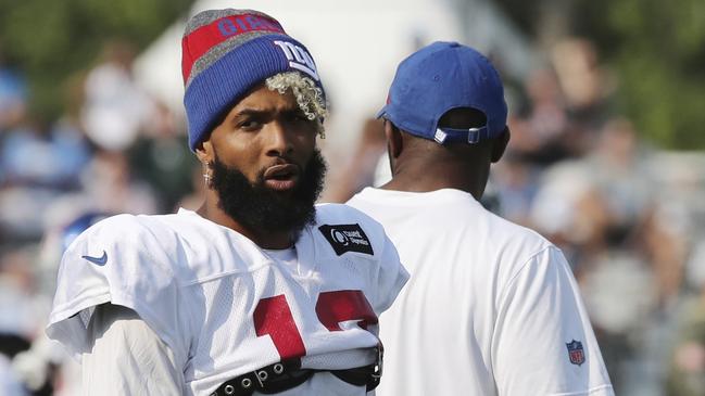 New York Giants receiver Odell Beckham Jr., walks on the field at the Detroit Lions football training facility, Tuesday, Aug. 14, 2018, in Allen Park, Mich. (AP Photo/Carlos Osorio)