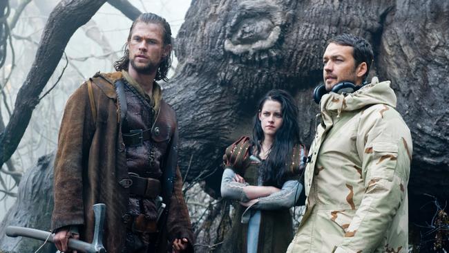 Actors Chris Hemsworth, from and Kristen Stewart with director Rupert Sanders on the set of Snow White and the Huntsman. Picture: AP/Universal Pictures, Alex Bailey