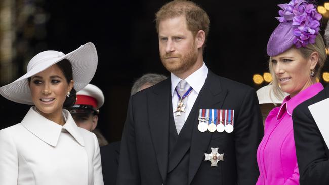 Prince Harry, Duke of Sussex, Meghan, Duchess of Sussex and Zara Tindall leaving the National Service of thanksgiving to Celebrate the Platinum Jubilee of Her Majesty The Queen at St Paul's Cathedral on June 3, 2022. (Photo by Humphrey Nemar – WPA Pool/Getty Images)