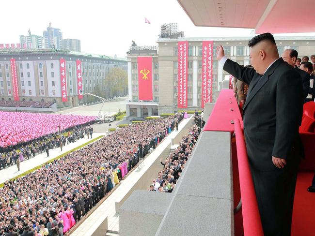 North Korean leader Kim Jong-un waving to people after the military parade in Pyongyang on Saturday. Picture: AFP/KCNA via KNS/STR/South Korea OUT/REPUBLIC OF KOREA OUT.