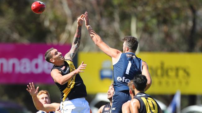 Jesse White and Keegan Brooksby go up for the ruck. Picture: Tait Schmaal.