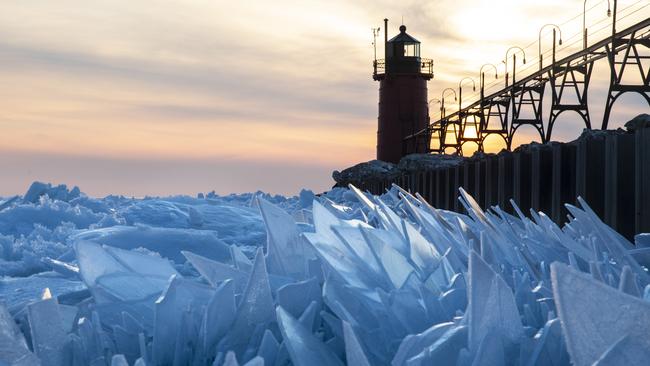 Shards of ice pile up on Lake Michigan along the South Haven Pier in South Haven, Mich.,  on Tuesday, March 19, 2019. (Joel Bissell/Kalamazoo Gazette via AP)