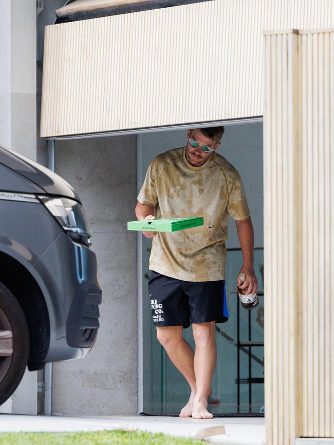 David Warner was spotted leaving home in Maroubra on Monday with hangover essentials in hand. Picture: NCA NewsWire / David Swift