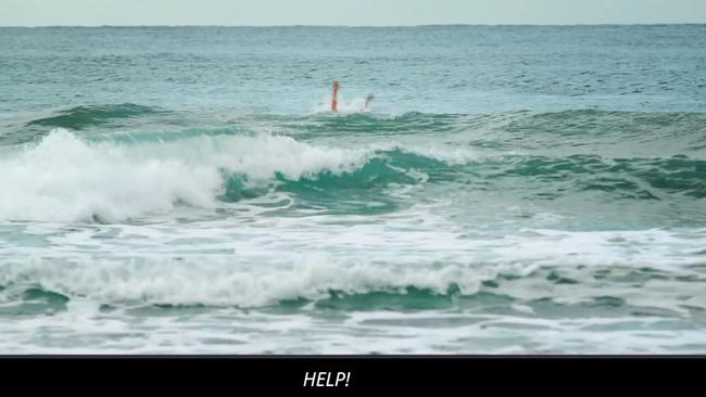 A swimmer cries for help in the attack ad. 