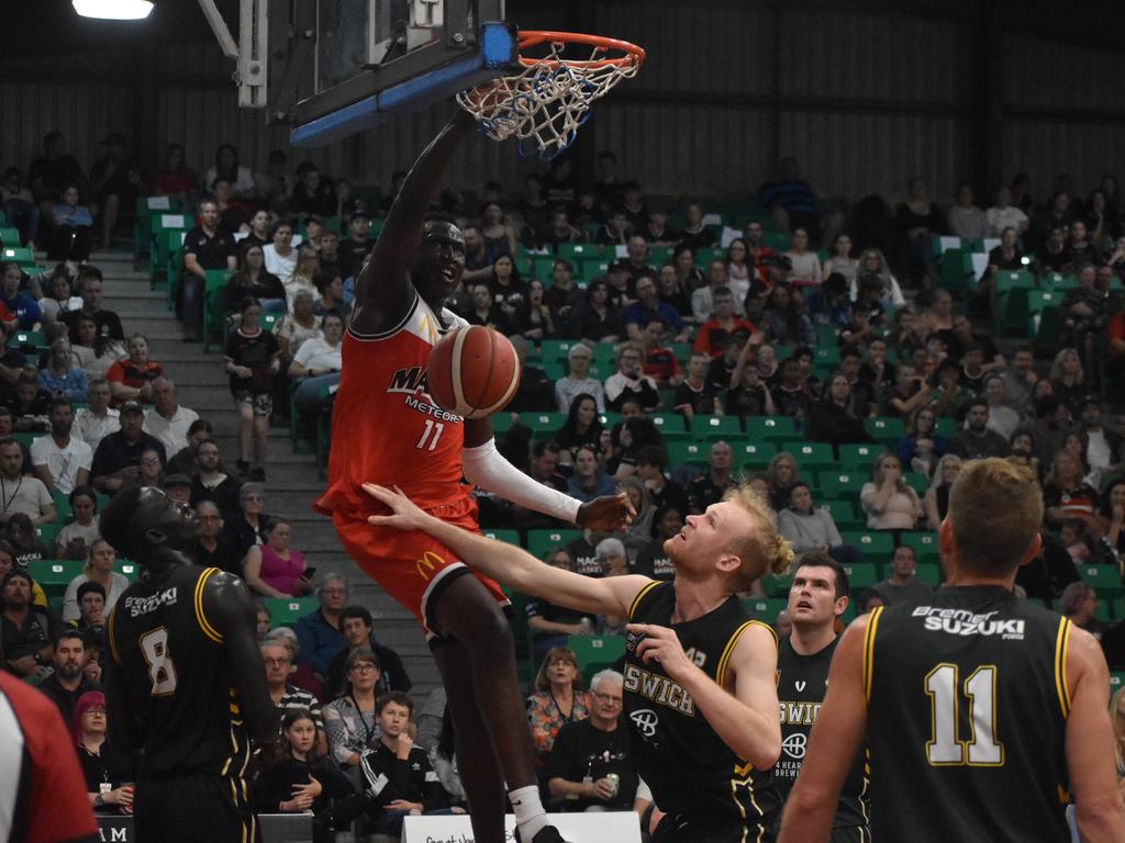Emmanuel Malou throws down a dunk for Mackay Meteors against Ipswich Force in the NBL1 North match, July 24 2021. Picture: Matthew Forrest