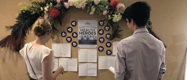 Darling Downs Health Staff admiring the letters sent in from our littlest of community members.