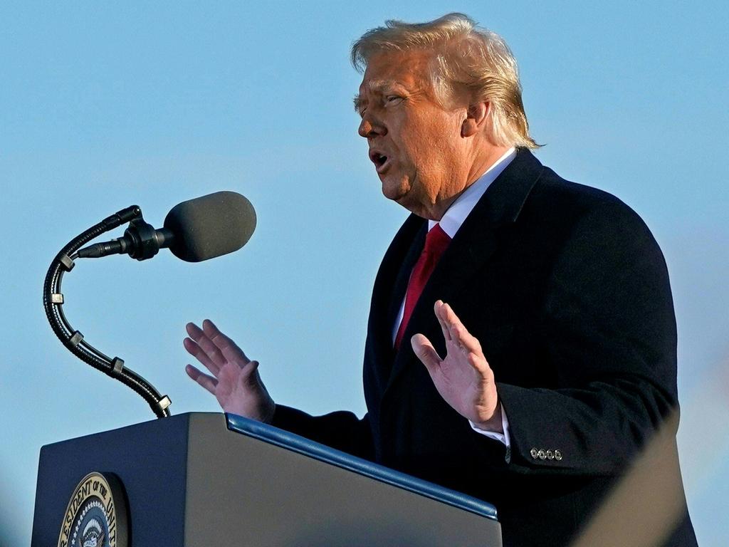 Former president Donald Trump talks to supporters at Joint Base Andrews before boarding Air Force One for the last time. Picture: AFP