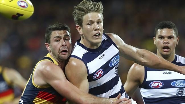 Adelaide Crows’ Rory Atkins battles against Geelong’s Rhys Stanley. Picture: SARAH REED