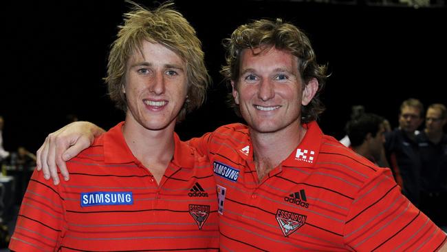 Essendon coach James Hird stands proud with Dyson Heppell after he joined the Bombers in the 2010 national draft.