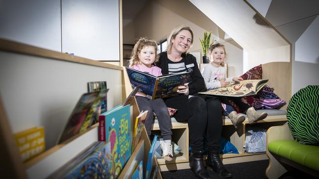 Director, Kellie Bruce with twin sisters Claire (left) and Emily Gallahar, 4 at the new Green Point Discovery Early Learning Centre. Picture: LUKE BOWDEN