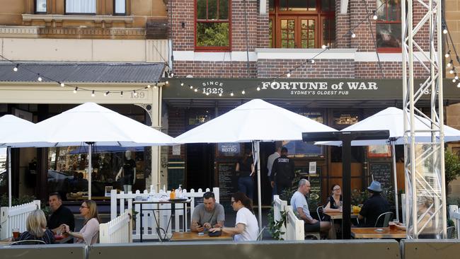 Alfresco dining on a closed section of George St at the Fortune Of War in The Rocks, as customers adapt to COVID-safe footpath dining. Picture: Jonathan Ng