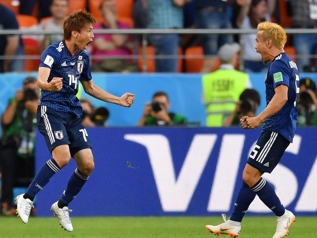 Japan's midfielder Takashi Inui (L) celebrates after scoring against Senegal. PIc: AFP