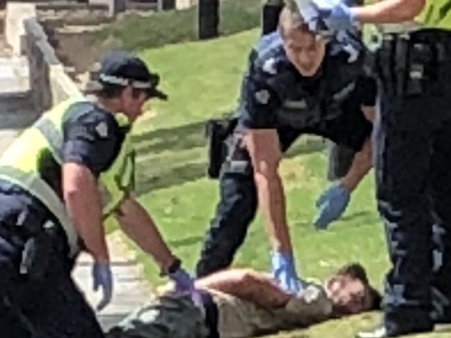 Police arrested a man after he threatened workers with a knife at Croydon station.