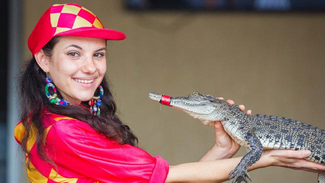 Bartender and ‘jockey’ Gypsy Cass with one of the elite crocs that took part in the racing at the Berry Springs Tavern. Picture: Glenn Campbell