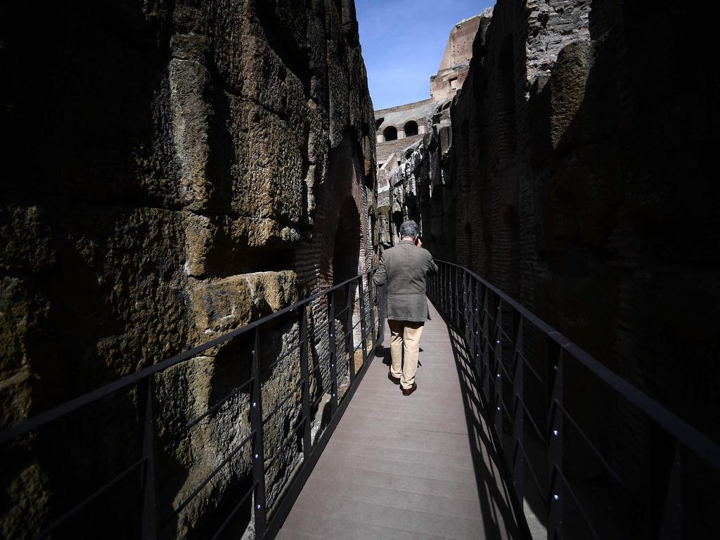 A visitor walks inside the Colosseum, which dungeons' restoration have been sponsored by fashion group Tod's, in Rome. Picture: Filippo Monteforte / AFP