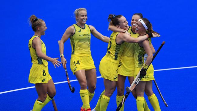 Hockeyroos players embrace after Savannah Fitzpatrick’s goal against Argentina. Picture: Adam Head