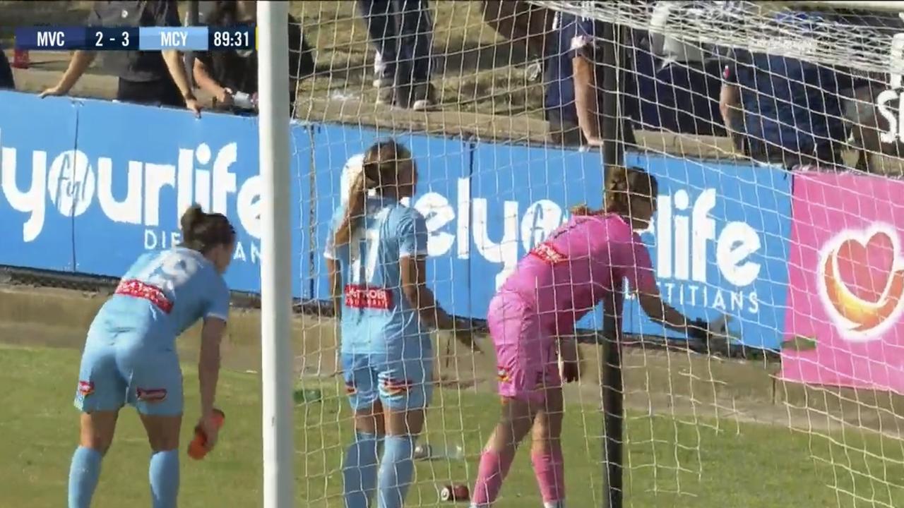 Items thrown onto the field during the W-League Melbourne derby had to be picked up by players.