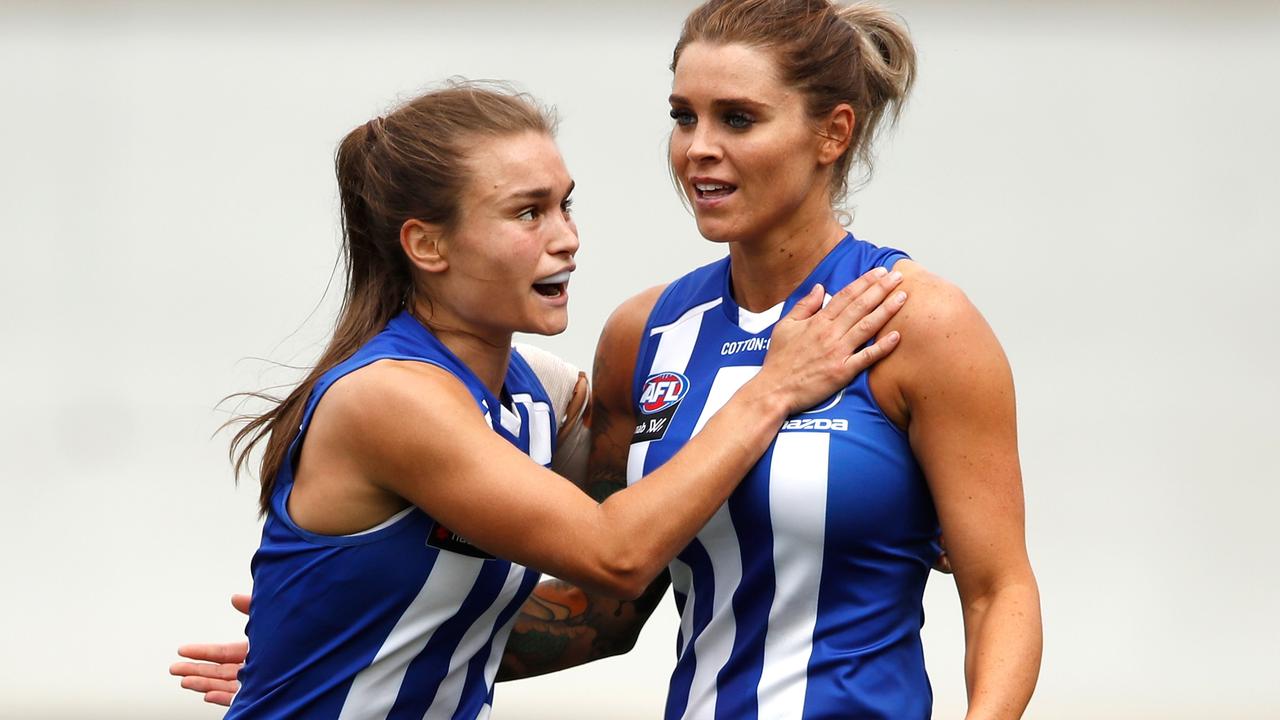 Sophie Abbatangelo and Ashleigh Riddell celebrate a Kangaroos goal. Picture: AFL Photos/Getty Images