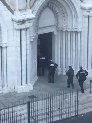 Police enter the church in Nice where three people were killed by a knife-wielding terrorist. Picture: Supplied