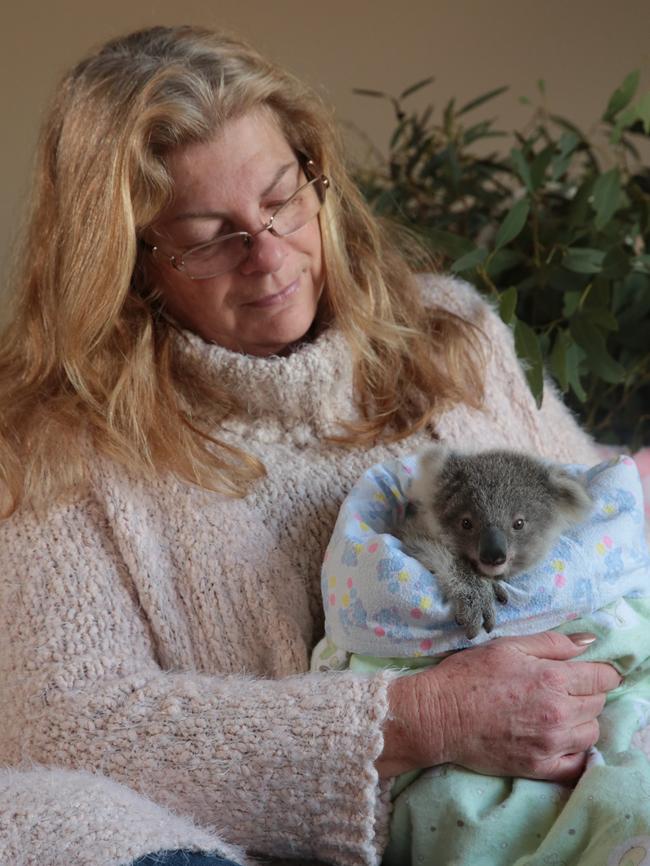 Cate Ryan with baby Peter when he came into care. Picture: Robert Pozo