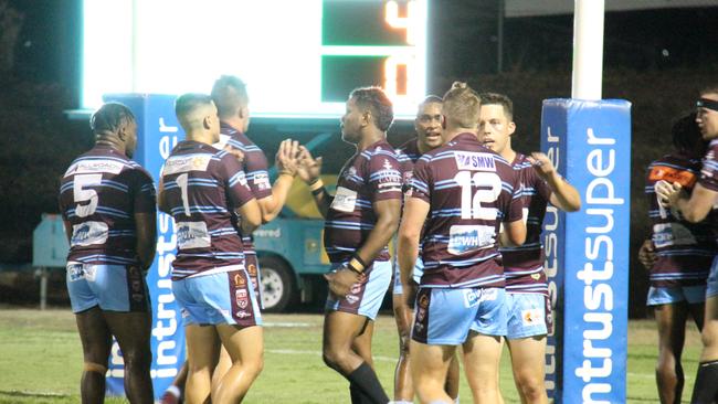 The Central Queensland Capras celebrate a try.