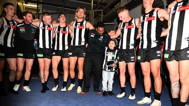 Kyron sings the Collingwood theme song in the rooms with his father and the Magpies’ players. Picture: AAP