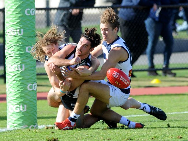 Jack Blair in and under in his time in the VFL. Picture: Andrew Henshaw