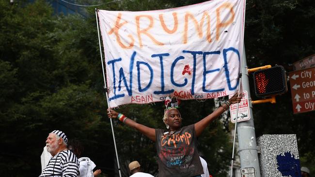 Supporters of former President Donald Trump and counter-protesters outside the Fulton County Courthouse. Picture: Getty Images/AFP.