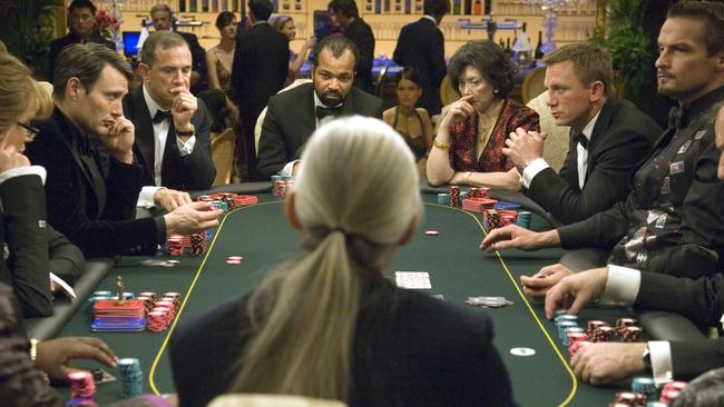 Mikkelsen (at left) as Le Chiffre and Daniel Craig (at right) as James Bond give each other the evil eye over the poker table in a scene from Casino Royale. Picture: Sony Pictures