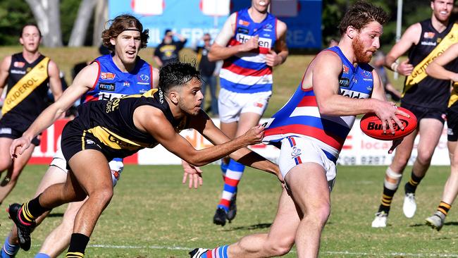 Cental's Jarrod Schiller is tackled by Tiger's Ian Milera at Elizabeth. Picture: Bianca De Marchi