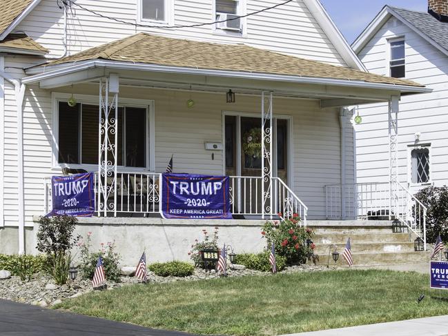 Trump/Pence campaign signs are seen in the front yard of a house in Old Forge. Picture: Angus Mordant for News Corp Australia