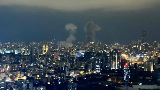 Smoke plumes rise from the site of two Israeli airstrikes on a neighbourhood in Beirut on October 10, 2024. Picture: AFP.