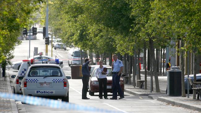 Police close off Little Malop St after the violent rape of a 22-year-old in 2006.