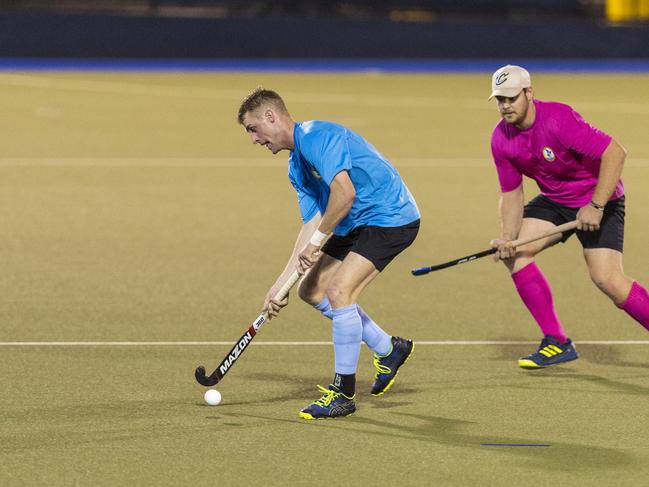 Kane Bradford (left) of SQPS Scorers and Cory Mogg of AgEtal Farmers in Club Glenvale Challenge round two men's hockey at Clyde Park, Friday, February 19, 2021. Picture: Kevin Farmer