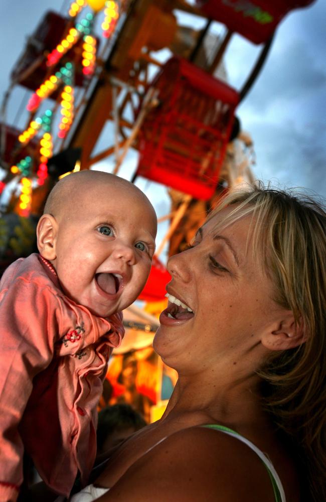 Tracey Toohey, from Essendon, and daughter Ashlee Clampit, 5 months, enjoy the carnival on the Rye foreshore on December 31, 2007. Picture: Gary Richardson