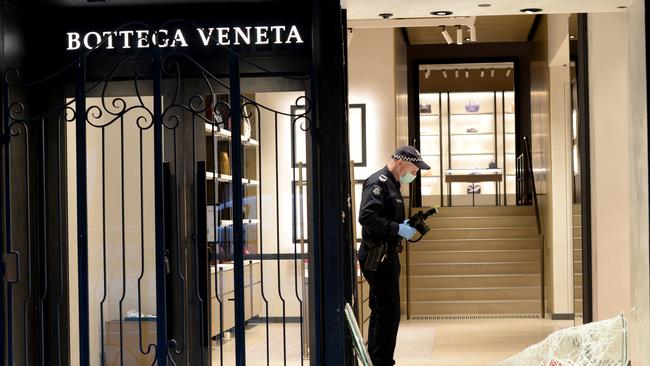 MELBOURNE, AUSTRALIA - NewsWire Photos FEBRUARY 24, 2021: Police at the scene of an early morning ram raid on Bottega Veneta, a high-end fashion boutique on Collins Street in central Melbourne. Picture: NCA NewsWire / Andrew Henshaw