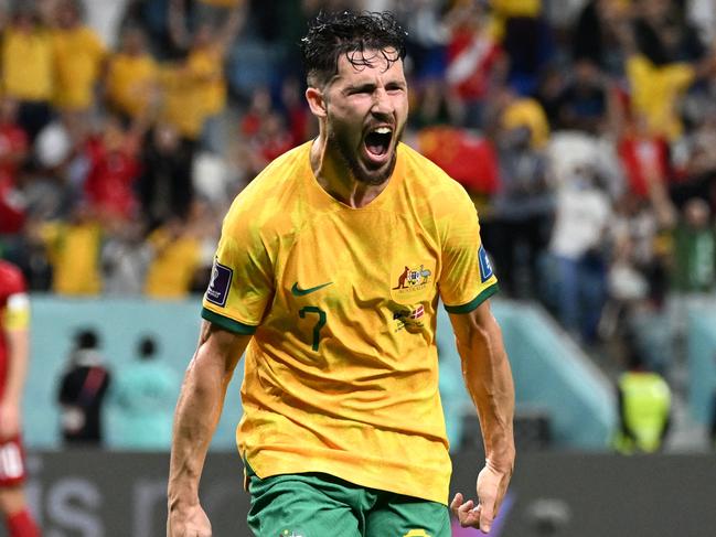 TOPSHOT - Australia's forward #07 Mathew Leckie celebrates scoring his team's first goal during the Qatar 2022 World Cup Group D football match between Australia and Denmark at the Al-Janoub Stadium in Al-Wakrah, south of Doha on November 30, 2022. (Photo by Chandan KHANNA / AFP)