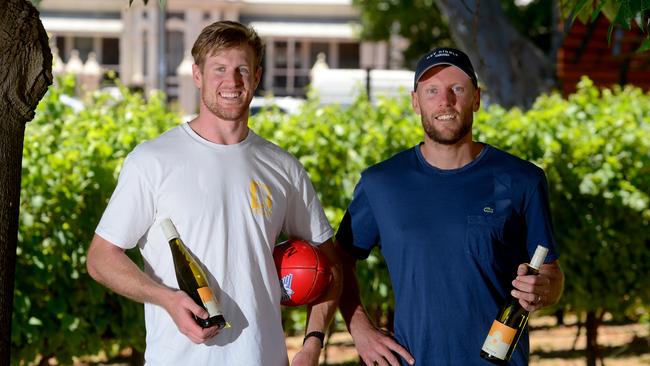 Port Adelaide captain Tom Jonas and former player Brad Ebert of Hey Diddle Wines. Photo: Sam Wundke