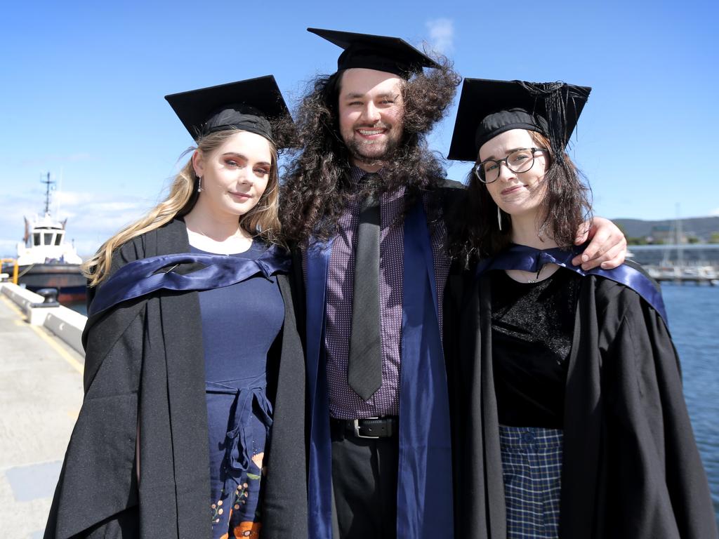 Bachelor of Arts graduate Ella Edwards, left, Diploma of Languages graduate Tyler Barron and Valedictorian and Bachelor of Arts graduate Emma Coad. Picture: PATRICK GEE