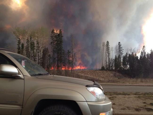 Thousands Flee Raging Wildfire In The Canadian Oil Sands City Of Fort Mcmurray Alberta Herald Sun