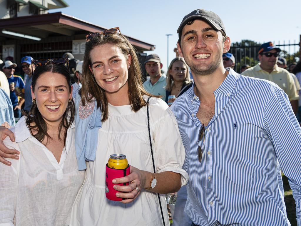 Getting together on Downs Rugby grand final day are (from left) Molly Wagner, Georgia Holmes supporting Goondiwindi and Joe Stephen supporting Dalby at Clive Berghofer Stadium, Saturday, August 24, 2024. Picture: Kevin Farmer